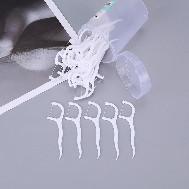 Limpiar el hilo dental portátil desechables envases desechables de Enfermería de la seda dental Stick Familia Floss FLOSS