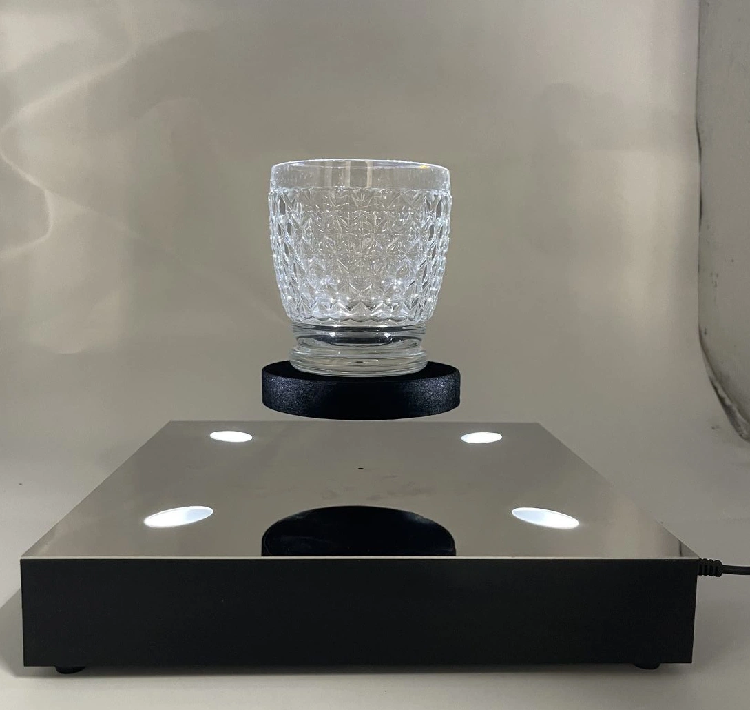 Rotación de la superficie de acero inoxidable 360 de levitación magnética escritorio flotante de 500 g Mostrar Rack para zapatos celular ver