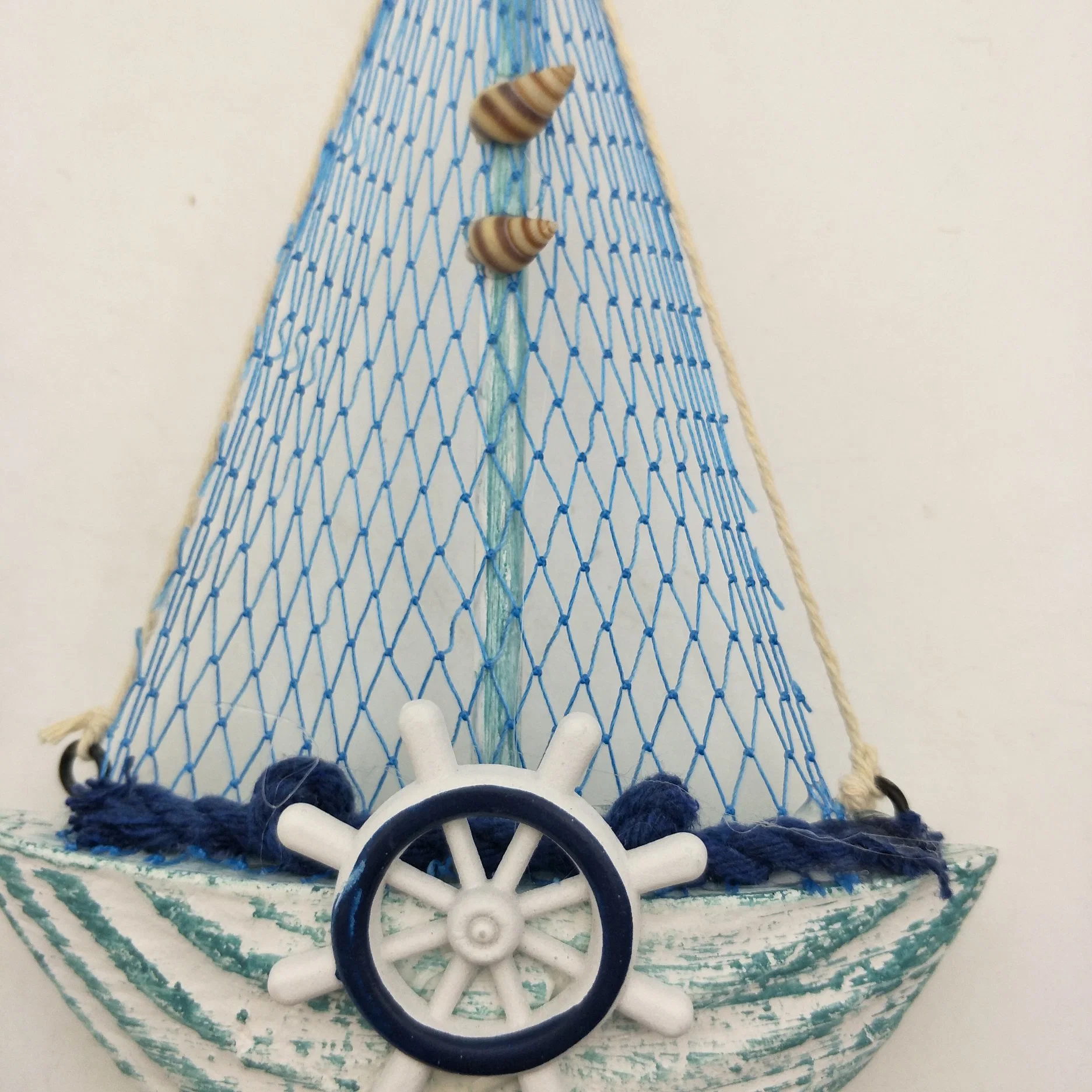 Blue Wooden Sailboat with Fishing Net