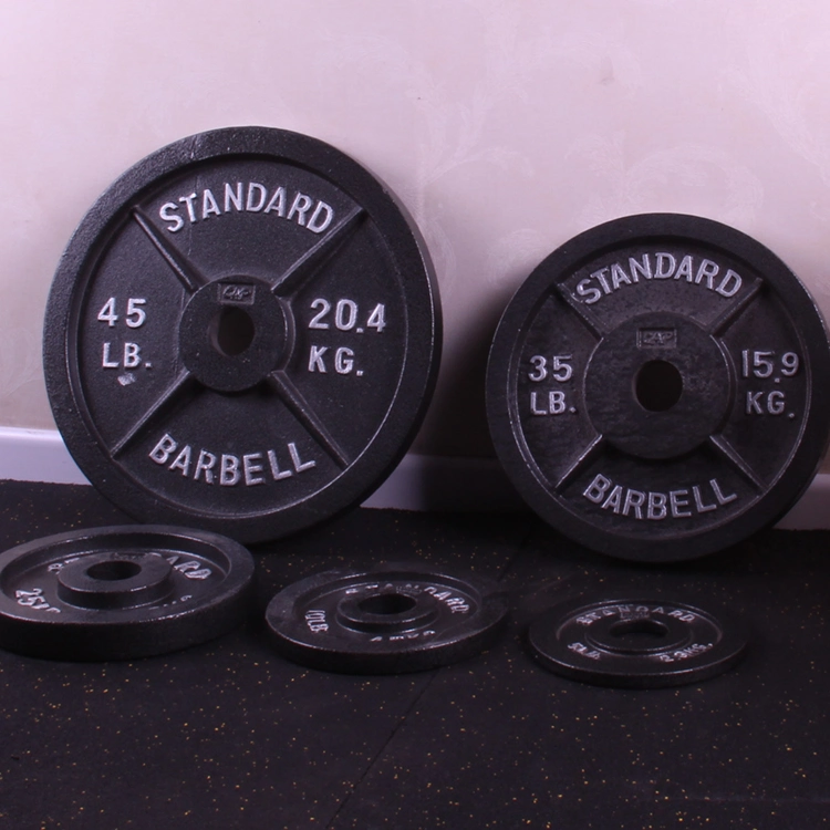 Plaques de poids en fonte pour haltère de fitness à domicile, idéales pour la musculation en salle de sport.