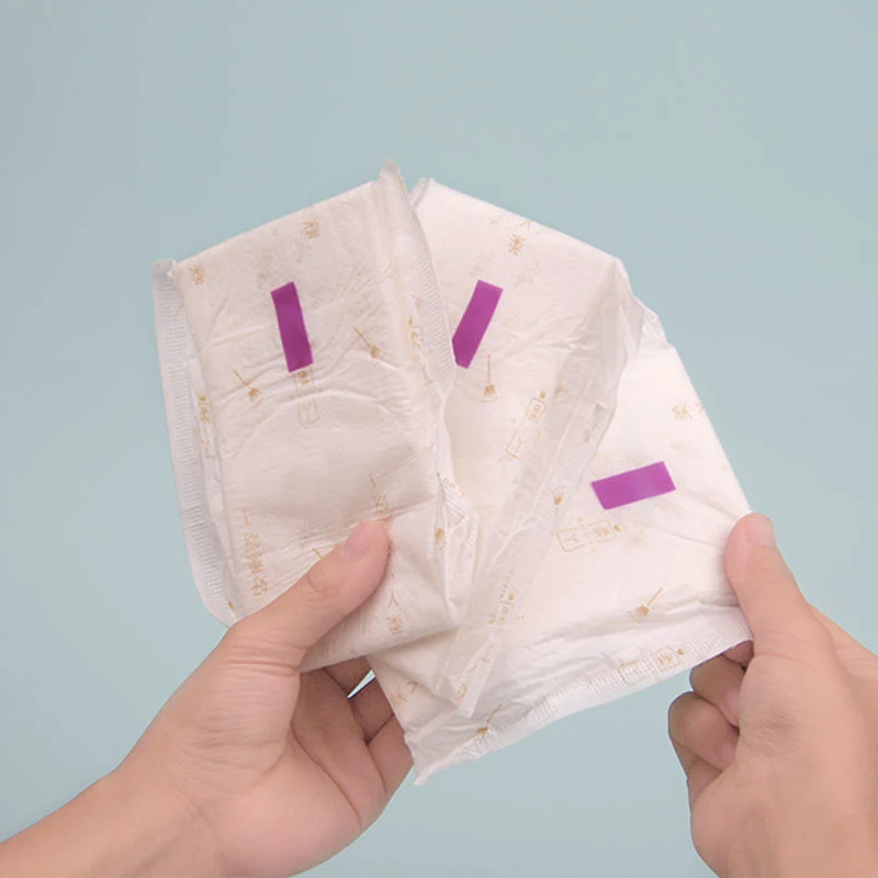 Muestra gratuita de las mujeres de la menstruación Organic Sanitary Napkin Pads Mayoreo delgado Servilletas Sanitarias Servilletas Sanitarias personalizadas Alta calidad