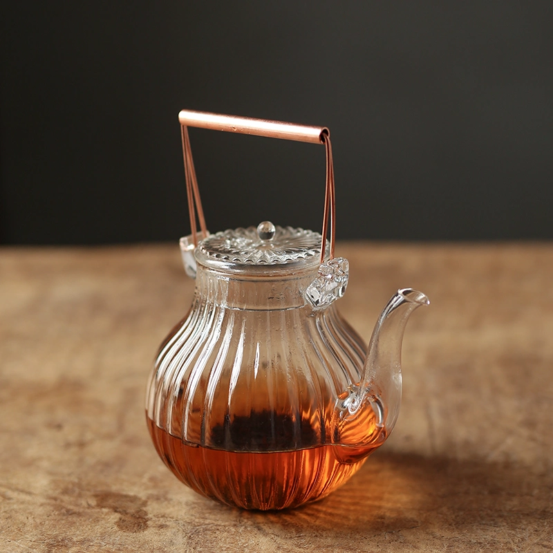 850ml Heart-Resistant Borosilicate Glass Teapot Set. Glass Tea Kettle with Copper Handle and Glass Filter