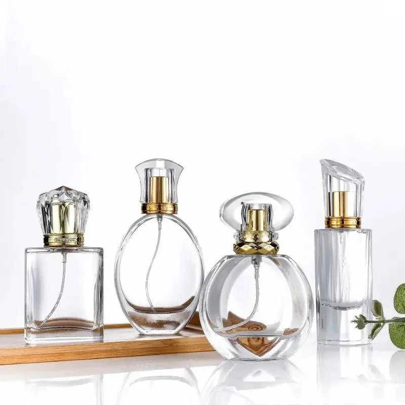 Manufacture Wholesale/Supplier Modern Round Empty Transparent 20ml 30ml 50ml Perfume Bottles Glass with Cap