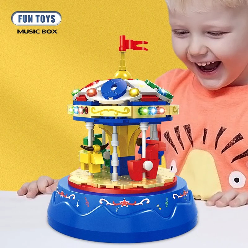 Woma Toys OEM ODM Spin Music Box Carousel Building Blocks لعبة الطوب للأطفال عيد ميلاد المسيح هدايا جو منزل الديكور