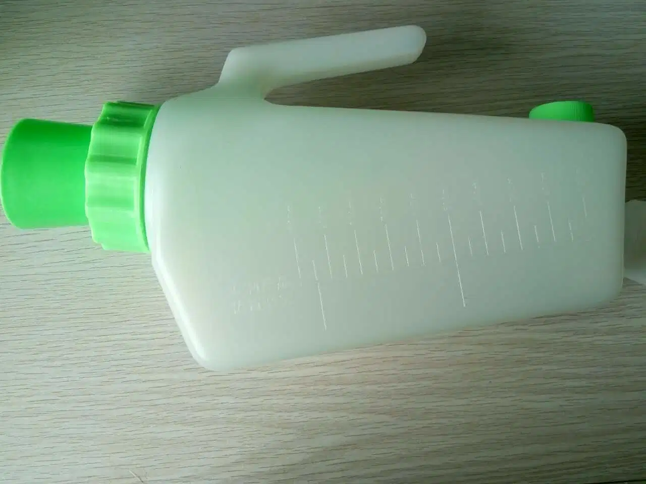 OEM disponible 1000ml Unisex plástico desechable botella de orina a prueba de derrames Urinal