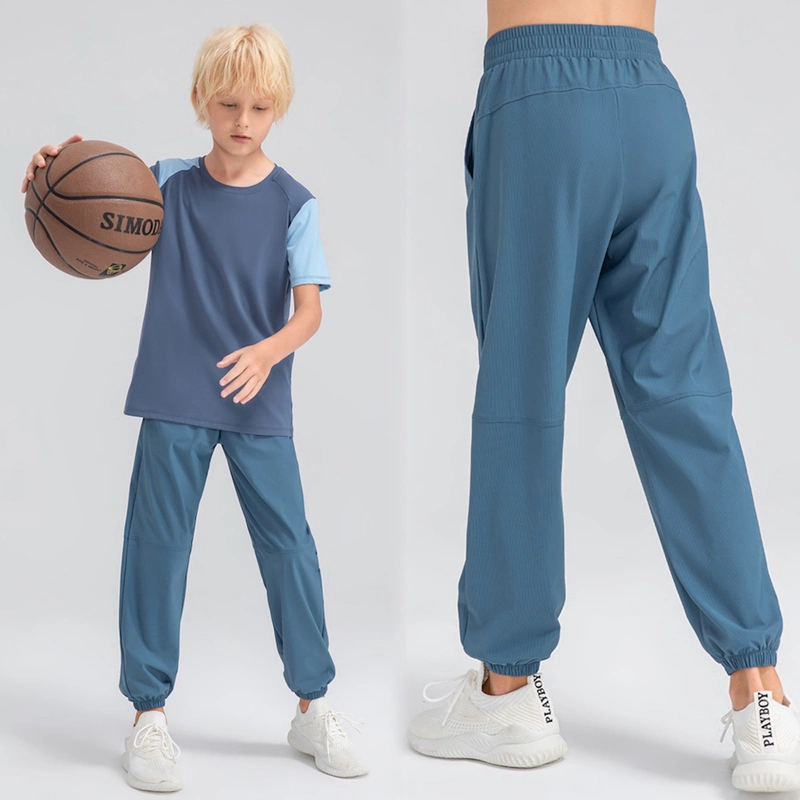 Pantalón de chándal informal de ajuste holgado con bolsillos laterales ligero para jóvenes Pantalón deportivo activo de secado rápido para niños