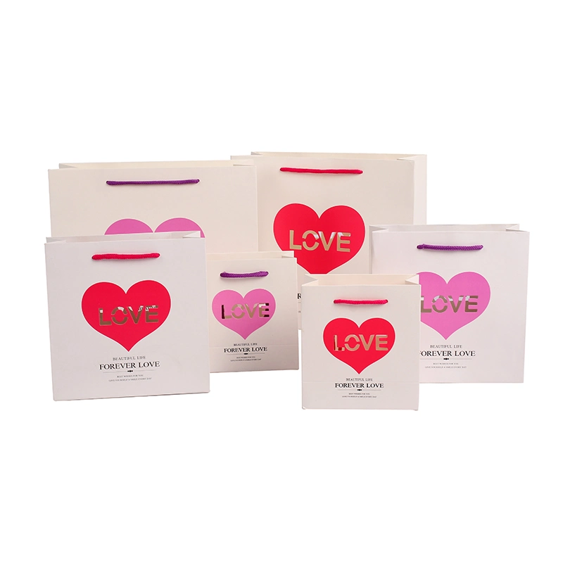 on Sale Stock Paper Gift Bags with Hollow out Love Design