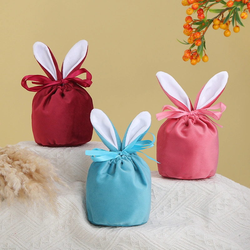 La Pascua Regalos y artesanías de conejito de peluche de caramelos de colores bolsa de regalo en el oído del conejo de chocolate