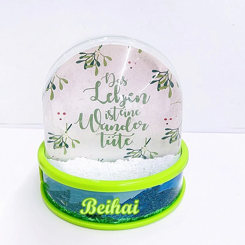 Personnalisez votre globe-boule à neige en plastique avec un motif flocon de neige