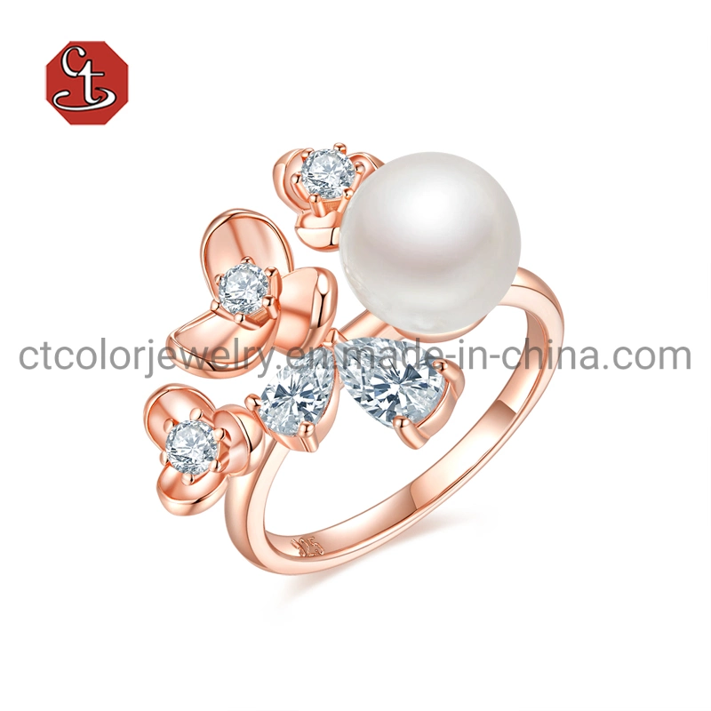 Bague, pendentif et boucles d'oreilles en argent plaqué or rose avec perle.