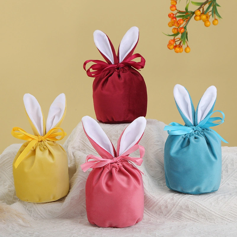 La Pascua Regalos y artesanías de conejito de peluche de caramelos de colores bolsa de regalo en el oído del conejo de chocolate