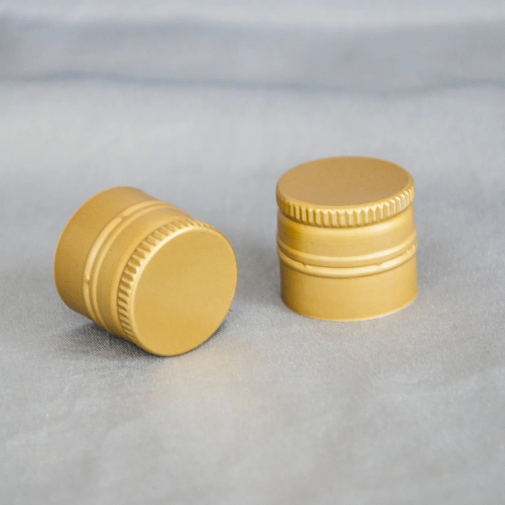 Most Popular Accepted Customization 18mm 20mm 22mm 24mm 25mm 28mm Roll on Pilfer Proof Aluminum Ropp Cap for Glass Bottle