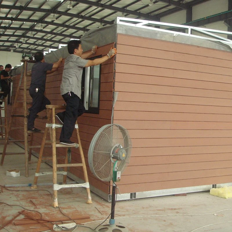 Installation rapide de maisons préfabriquées de bureau pliantes en conteneurs avec structure légère en acier.