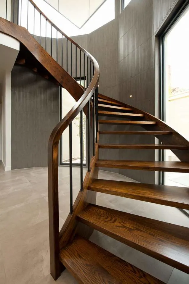 Interior Curved Staircase with Wrought Iron Balustrade