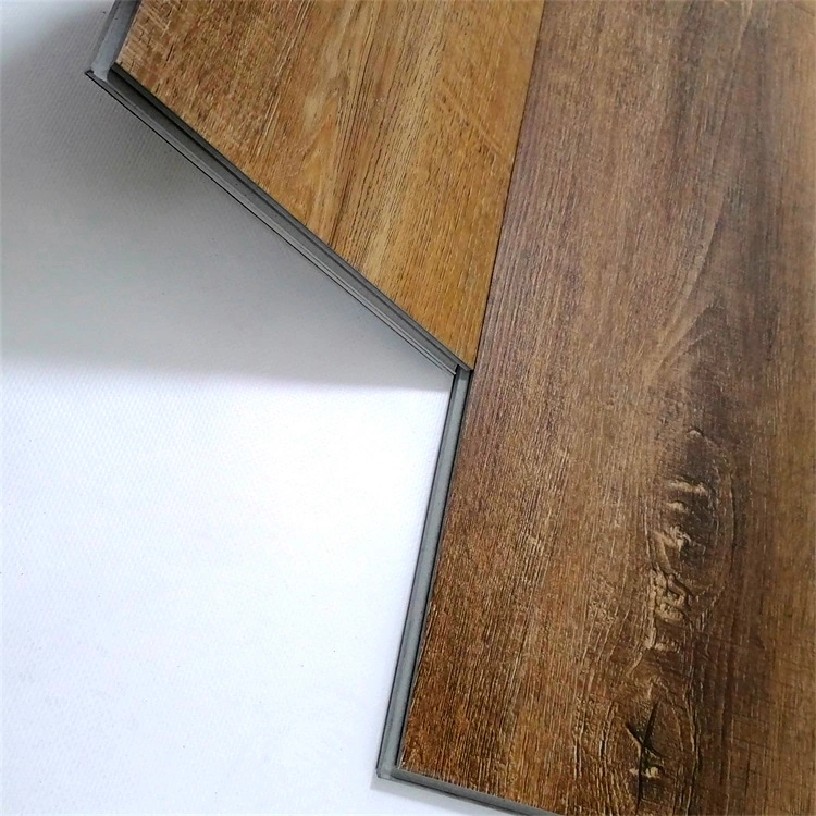 La lumière de luxe en bois de chêne regarder les planches de vinyle imperméable en plastique rigide en PVC de base des revêtements de sol