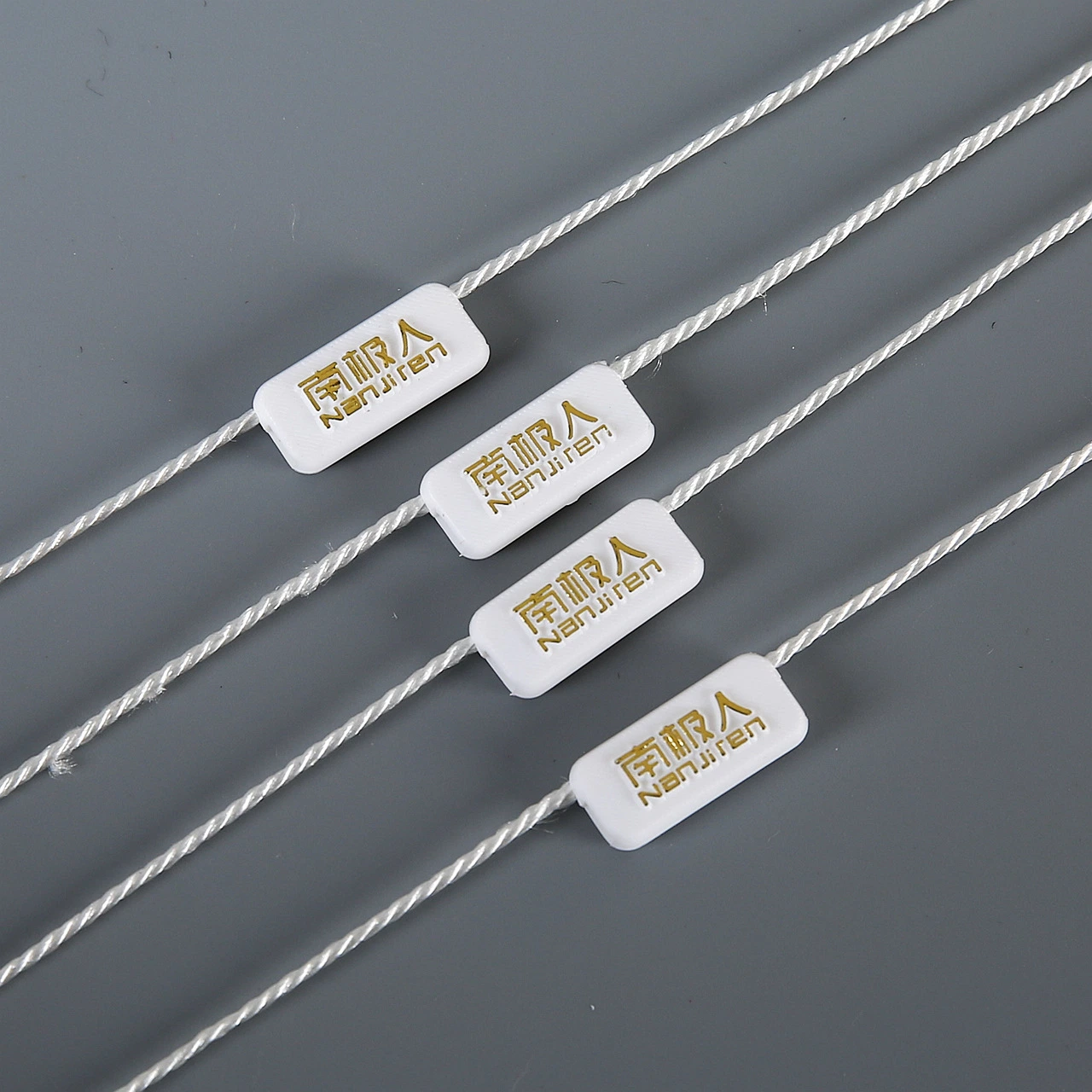 Factory Wholesale/Supplier Seal Tag Strings Lock for Tags/Custom Apparel Seal Tag Strings Seal Hang Tags for Clothes and Shoes