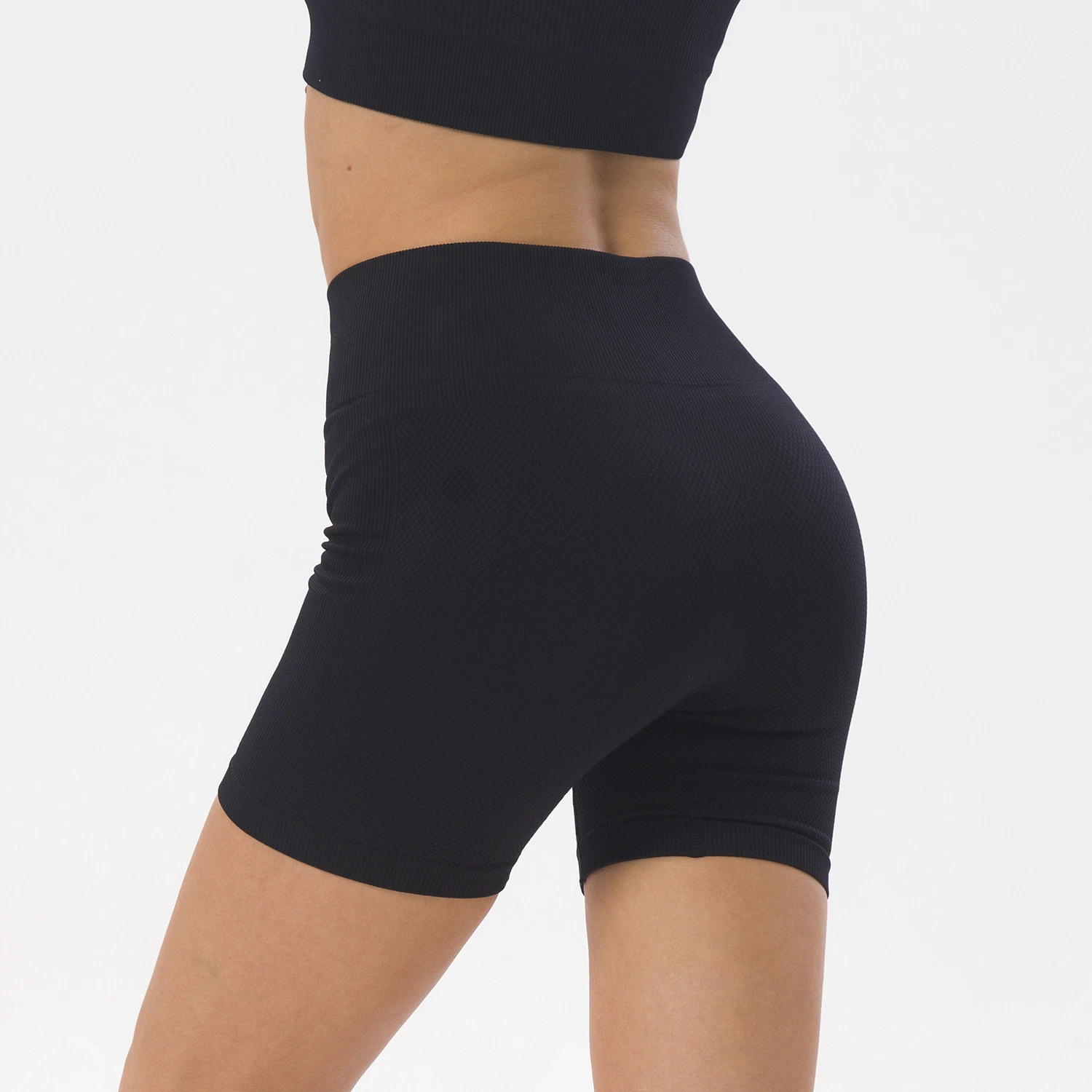 Mayorista de nuevos pantalones cortos deportivos de bolsillo para mujer Pantalón corto de yoga de cintura alta de punto sin costuras