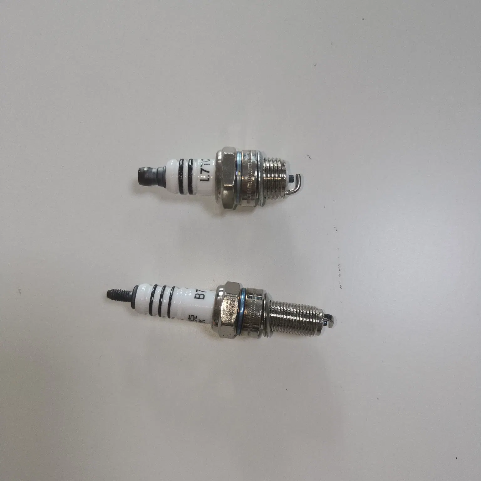 Cheap Wholesale/Supplier Factory Motorcycle Spare Parts Steel Spark Plug