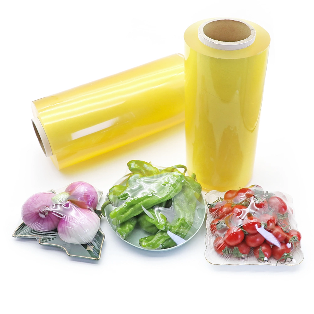 Film d'emballage en PVC de qualité alimentaire, film étirable transparent et imperméable à haute élasticité, matériau d'emballage en plastique, rouleau géant de film étirable pour emballage alimentaire.