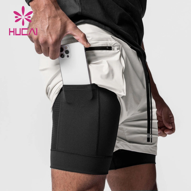 OEM ODM a medida de moda funcional de alta calidad de funcionamiento Gimnasio Loose Active Athletic Layered Zipper cargo Mens 2 en 1 Pantalones cortos deportivos
