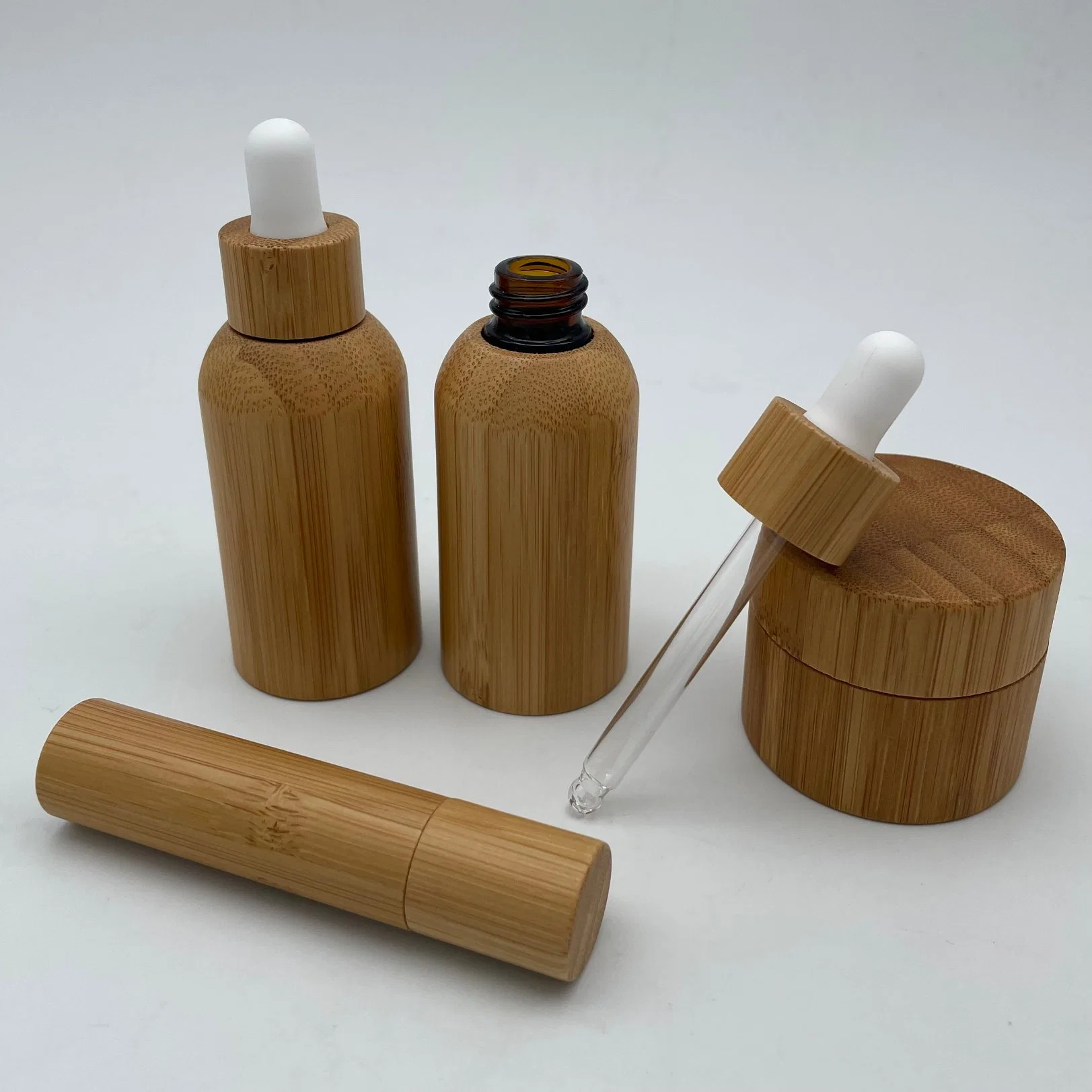 Precio de Fábrica de Venta caliente reactivo de bambú de la botella de cristal para el cuidado de piel