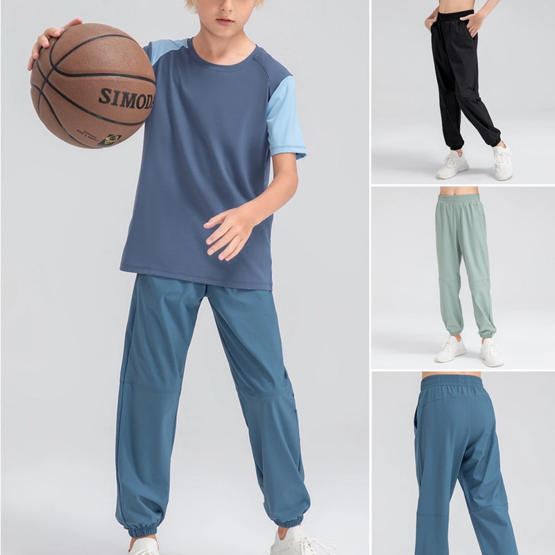Pantalón de chándal informal de ajuste holgado con bolsillos laterales ligero para jóvenes Pantalón deportivo activo de secado rápido para niños