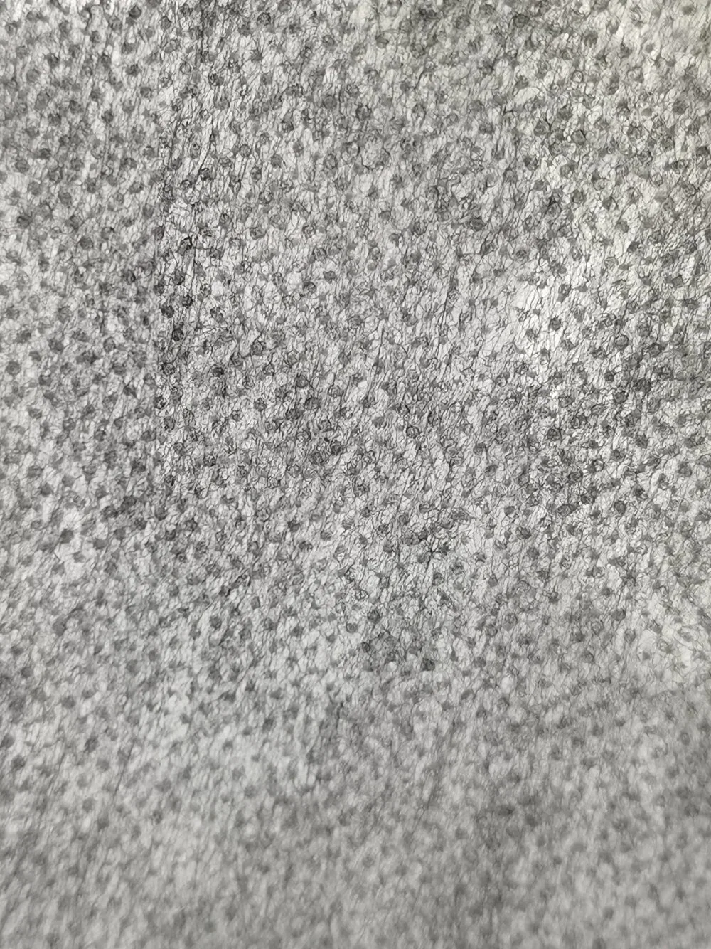 Nylon et polyester mélangés, entoilage thermocollant non tissé par liaison thermique.