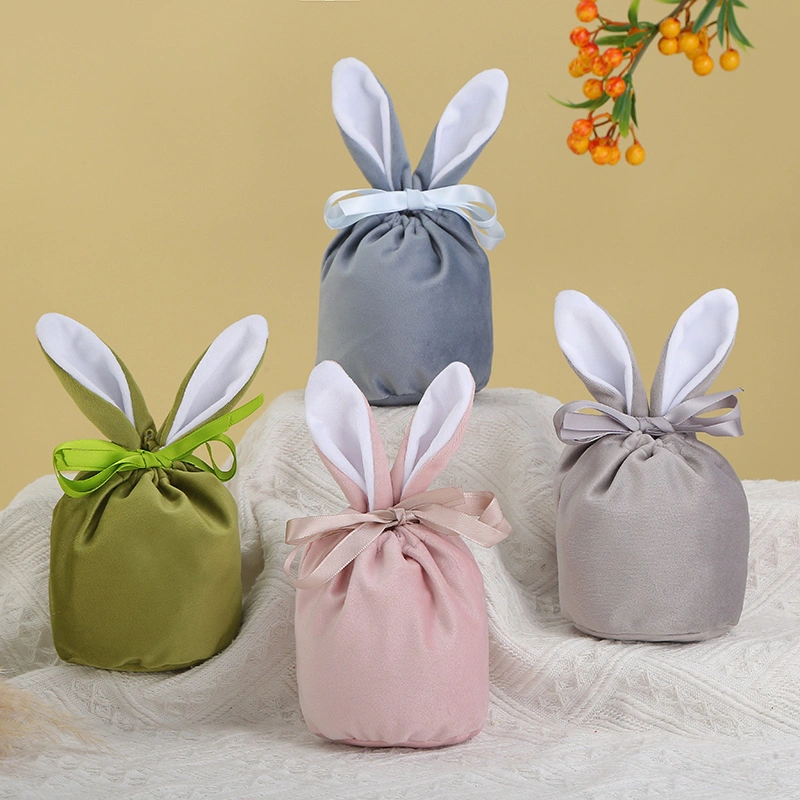 La Pascua Regalos y artesanías de conejito de peluche de caramelos de colores bolsa de regalo en el oído del conejo de chocolate