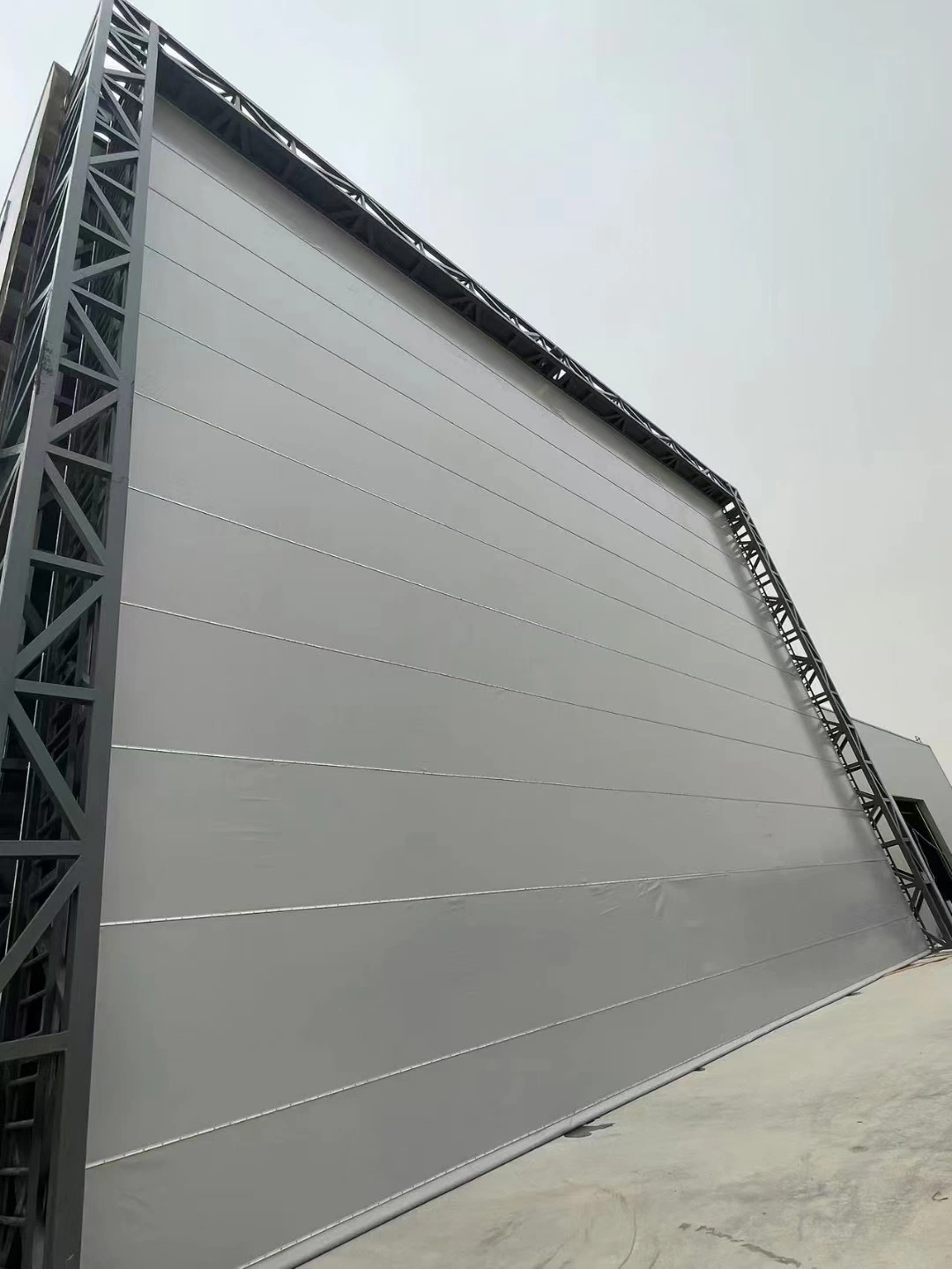 Industrial Automatic Steady China Cost Effictive Double PVC Fabric Steel Support Frame PVC Mega Hangar Door for Shipyard or Big Size Blast Painting Room