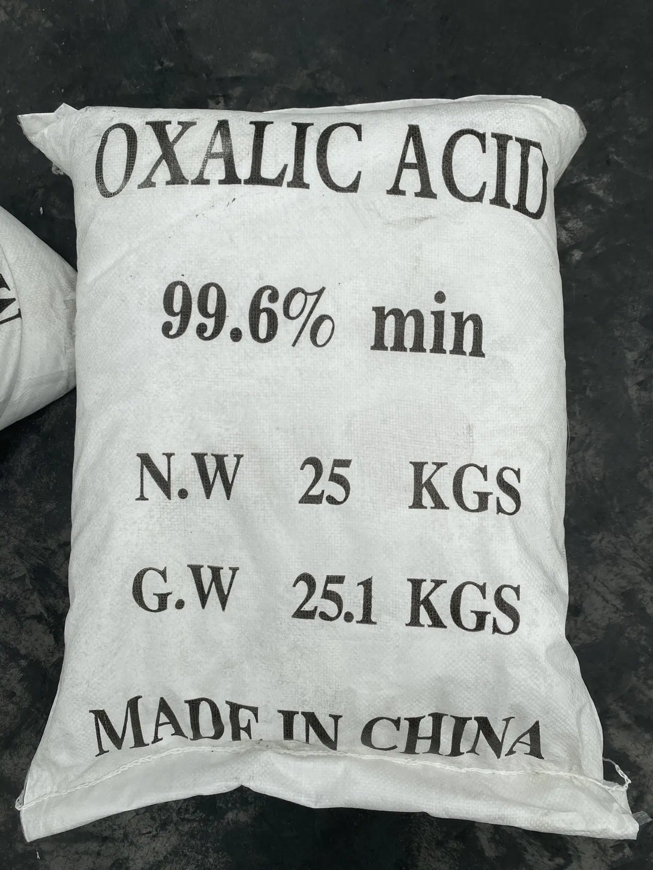 Pureza del ácido oxálico de grado industrial de alta calidad 99,6% Cristal blanco Polvo