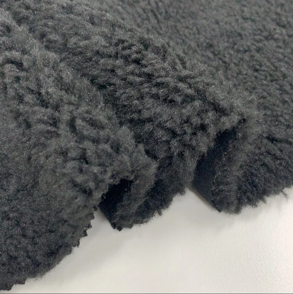 China Manufacturer Softshell Lamb Embossed Sherpa Faux Fur Fabric with Suede Bonding Fabric for Coat