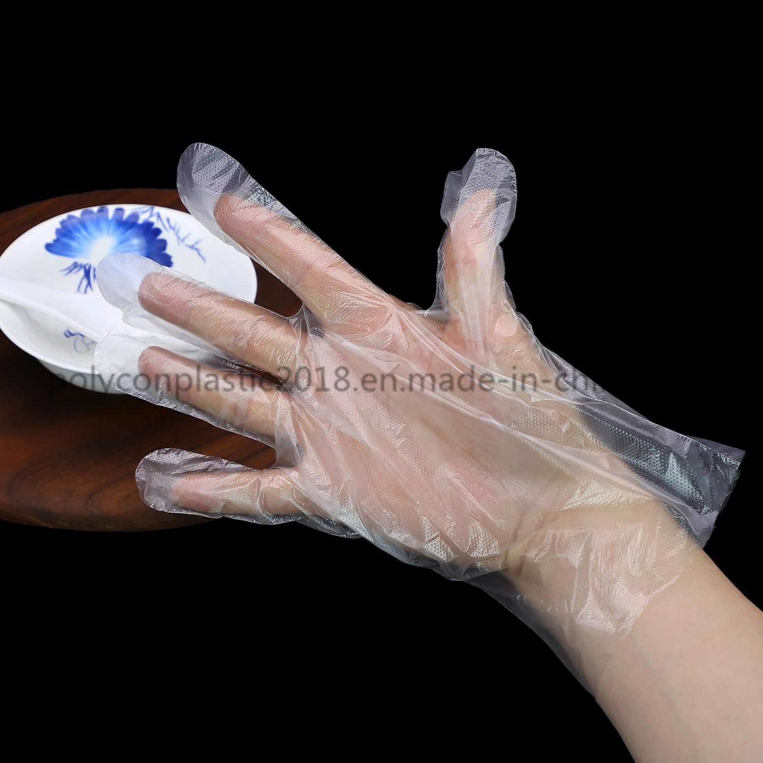 Vente à chaud de haute qualité en matière plastique de nettoyage de gros gants jetables PE gaufrage