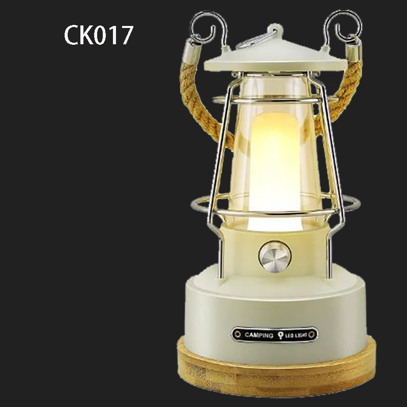 Lampe de camping vintage à LED rechargeable avec batterie et bandoulière.