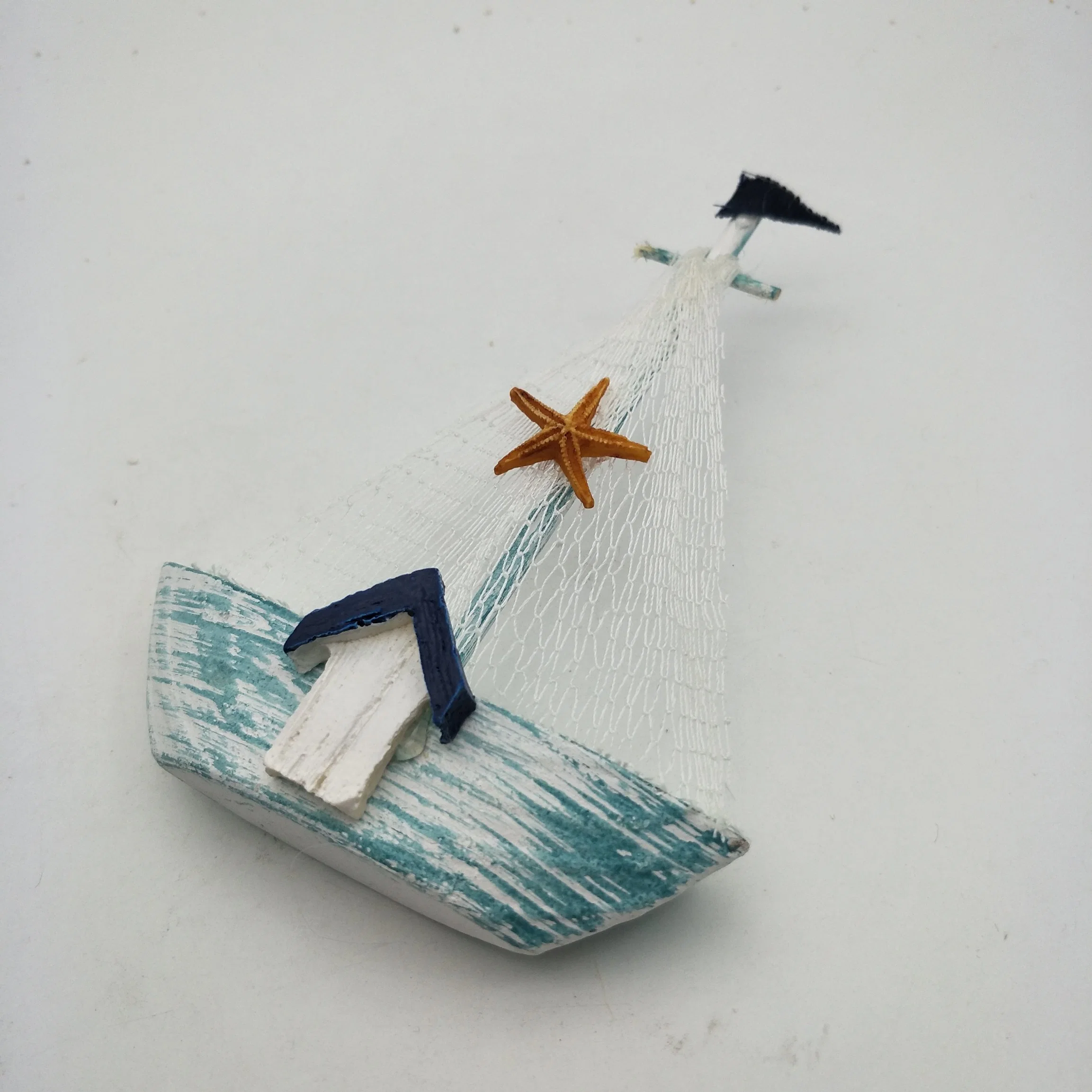 Blue Wooden Sailboat with Fishing Net