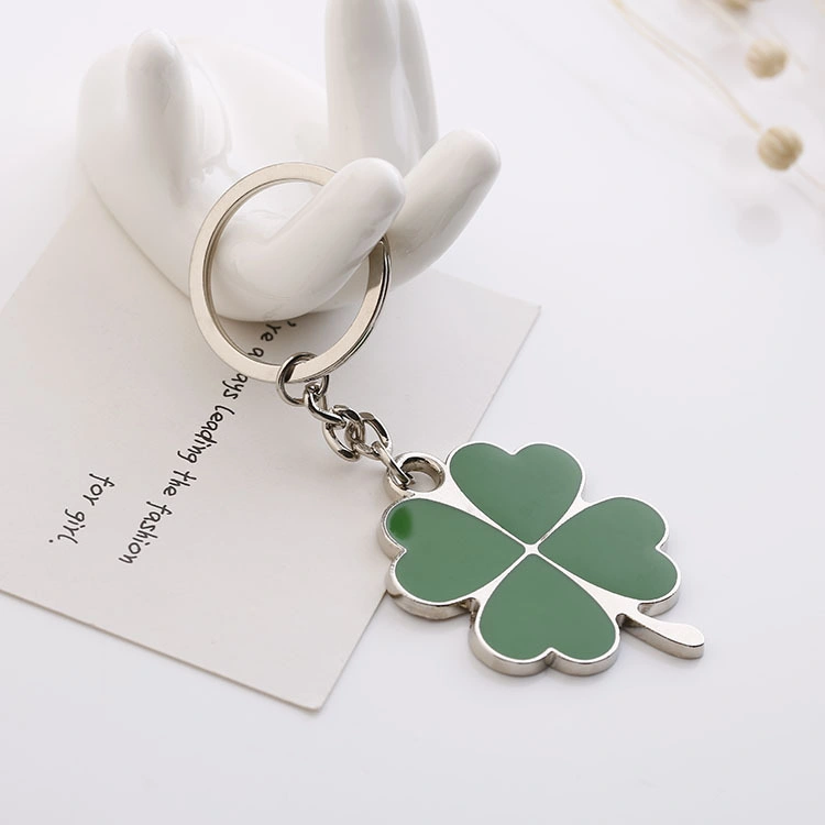 Ofertas pequenas do carro do Clover Lucky Metal Keychain do Clover da folha quatro creativas Grossista