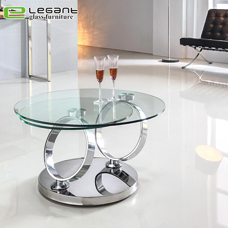 Table basse en verre trempé rotative avec base en acier inoxydable.