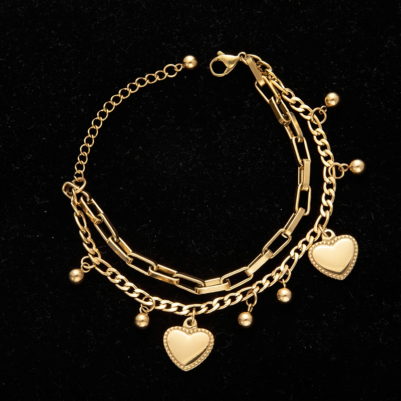 La nueva pulsera de acero de titanio estilo bohemio en forma de corazón con incrustaciones de oro mayorista de joyas de la mano de acero inoxidable