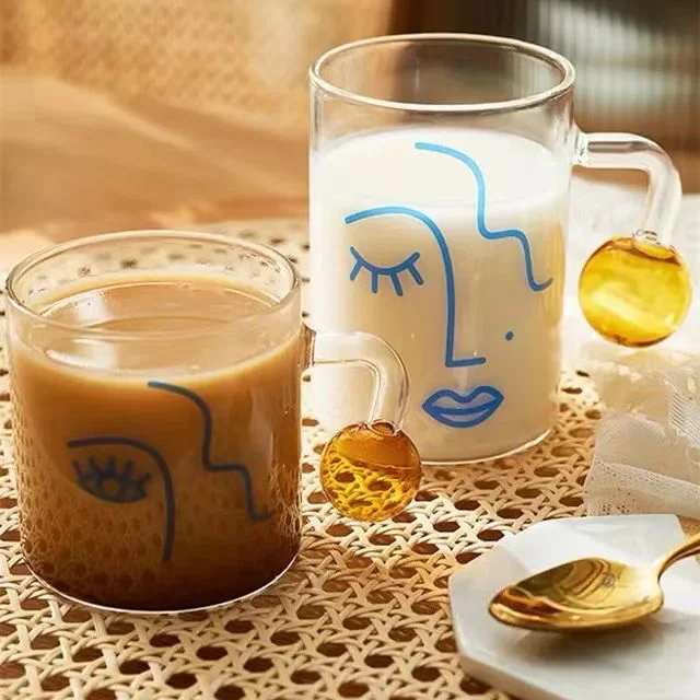 Heat Resistant Borosilicate Glass Coffee Mug with Abstract Face Printing with Ball Shape Handle