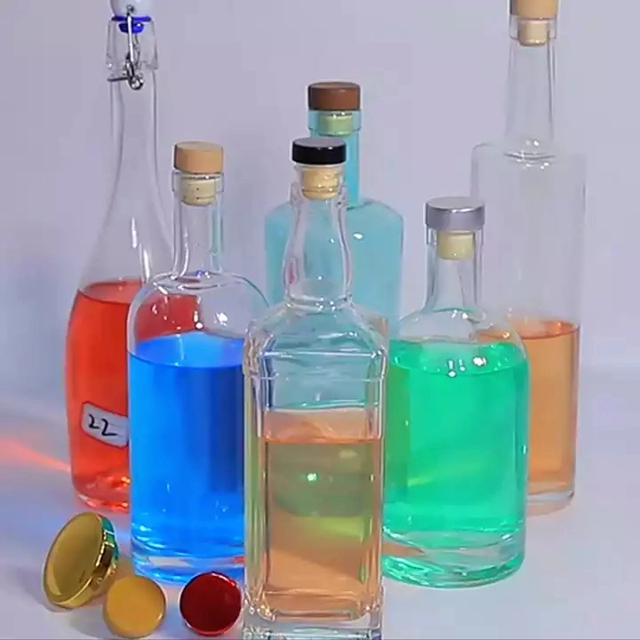 Curvas personalizadas de espesor de boca estrecha Botella de vidrio colorido Fondo para el Alcohol