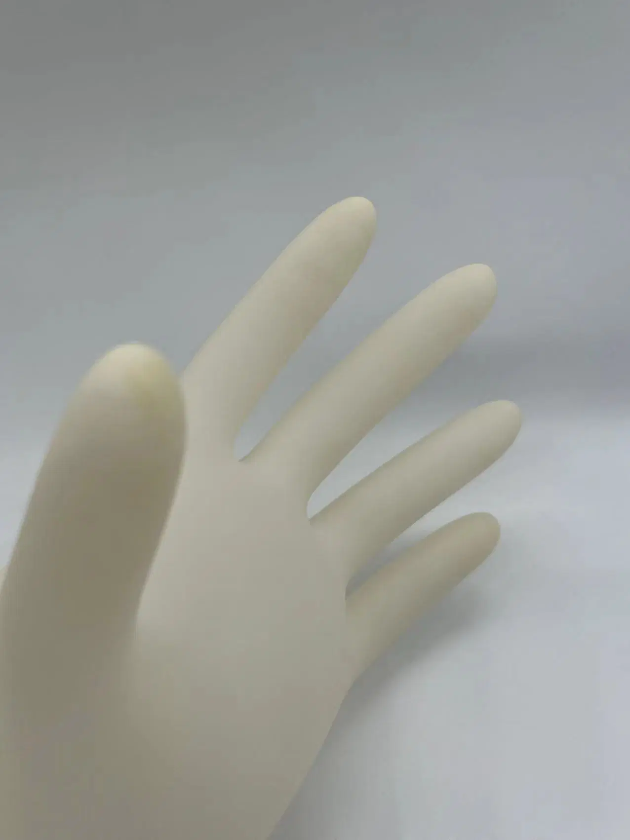 En Stock Los guantes de látex guantes quirúrgicos desechables de látex Examen Medico guantes estériles