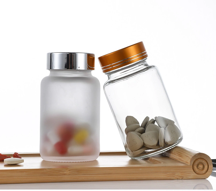 Tablet Capsule Clear Glass Bottle with Tablets and Pill