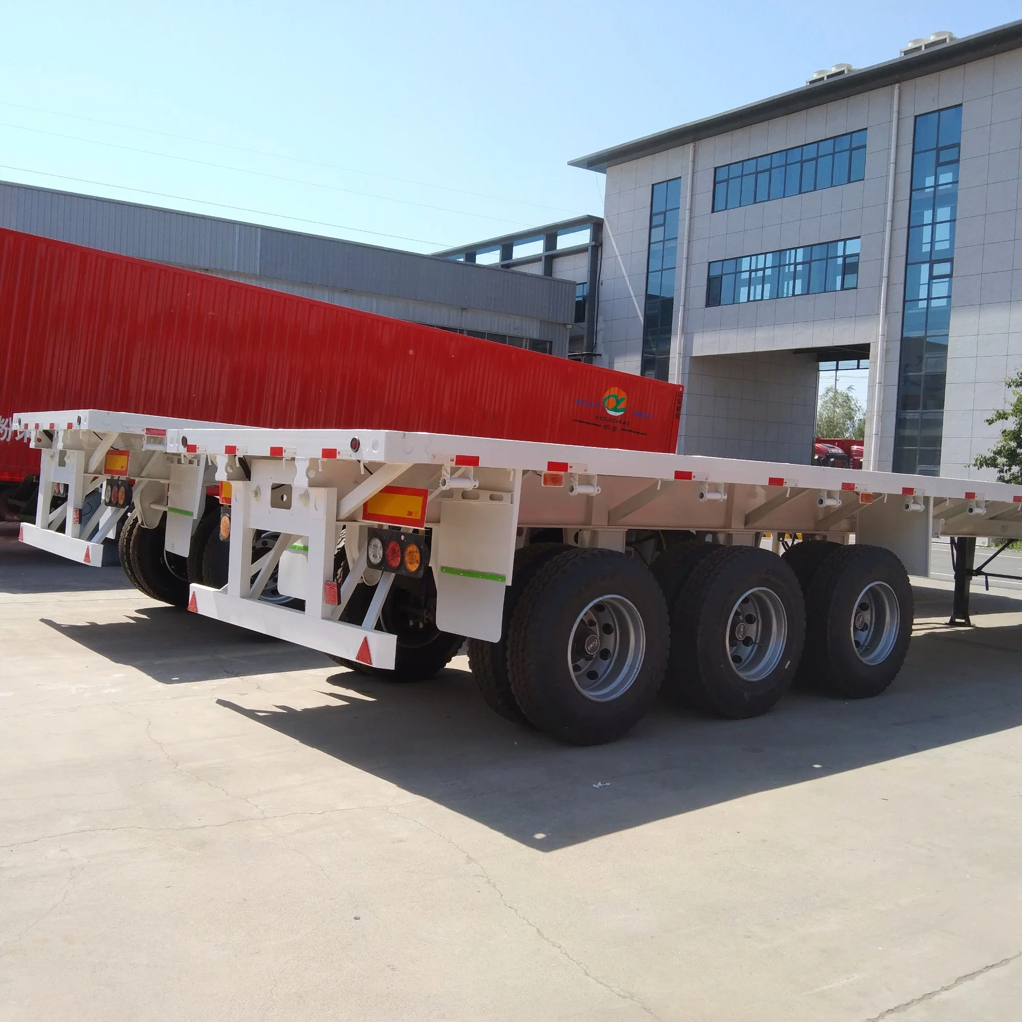 Xinya 4 essieux 80ton 40 FT 45FT Flat Bed Semi-remorque à conteneur remorque de camion d'occasion pour le Ghana