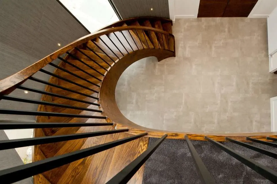 Interior Curved Staircase with Wrought Iron Balustrade