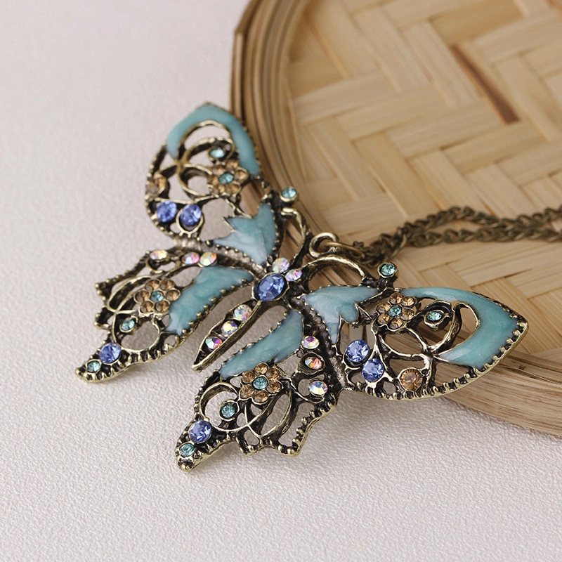 Manufacturer Wholesale/Supplier Jewelry Retro Hollow Oil Drip Butterfly Sweater Chain Necklace