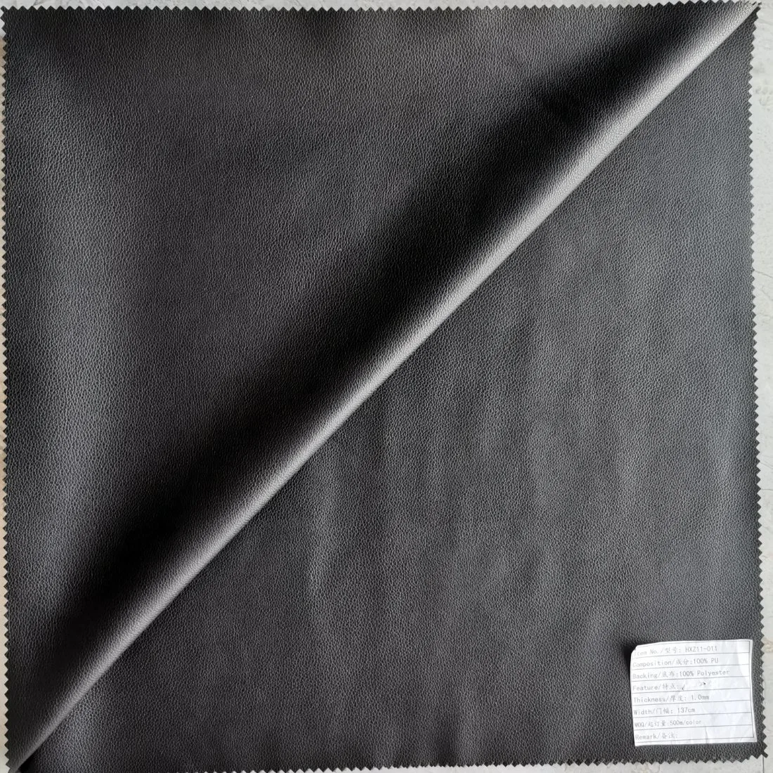 Imitation Cotton Backing Synthetic PU Leather with Soft Hand-Feel and Litchi Pattern Look