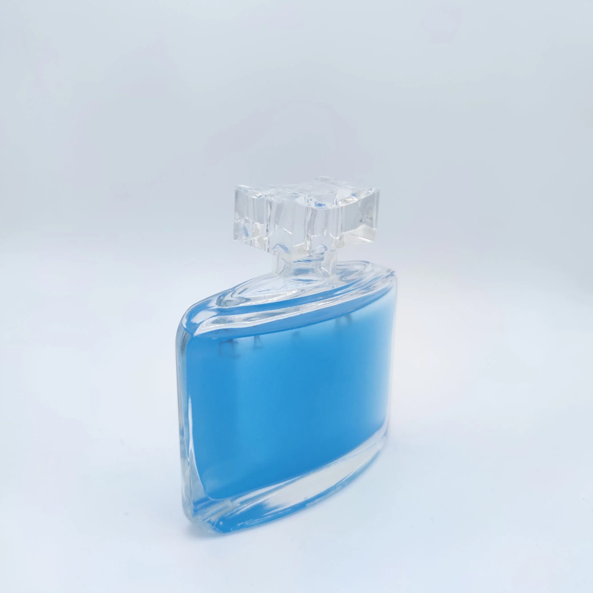 New Design Oval Shape Super Crystal Blue Glass Perfume Packaging Bottle Cosmetics Packaging Household Spray Bottles with Pump