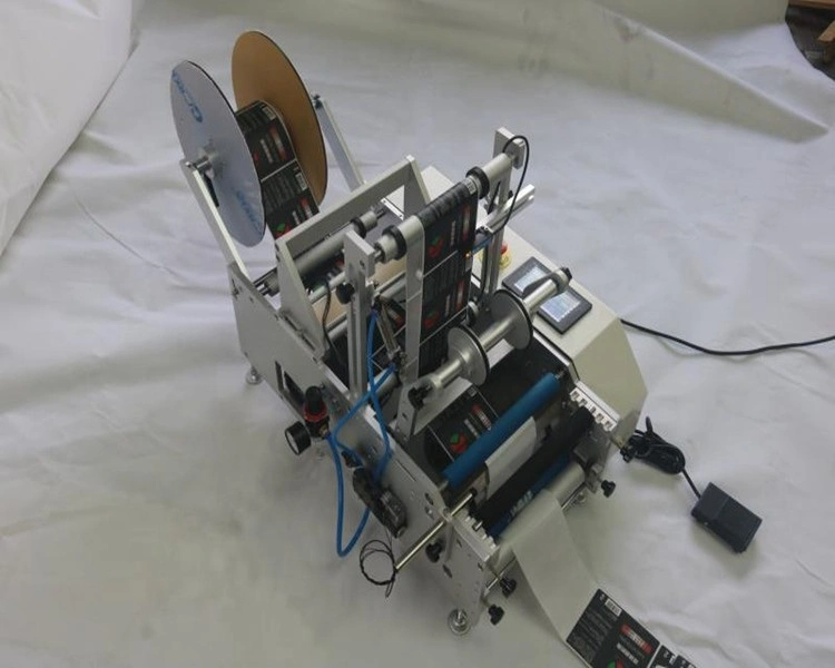 Machine d'impression d'étiquetage de flacons semi-automatique à étiquetage manuel Prix des flacons ronds