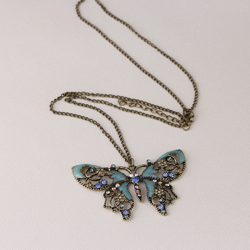 Manufacturer Wholesale/Supplier Jewelry Retro Hollow Oil Drip Butterfly Sweater Chain Necklace