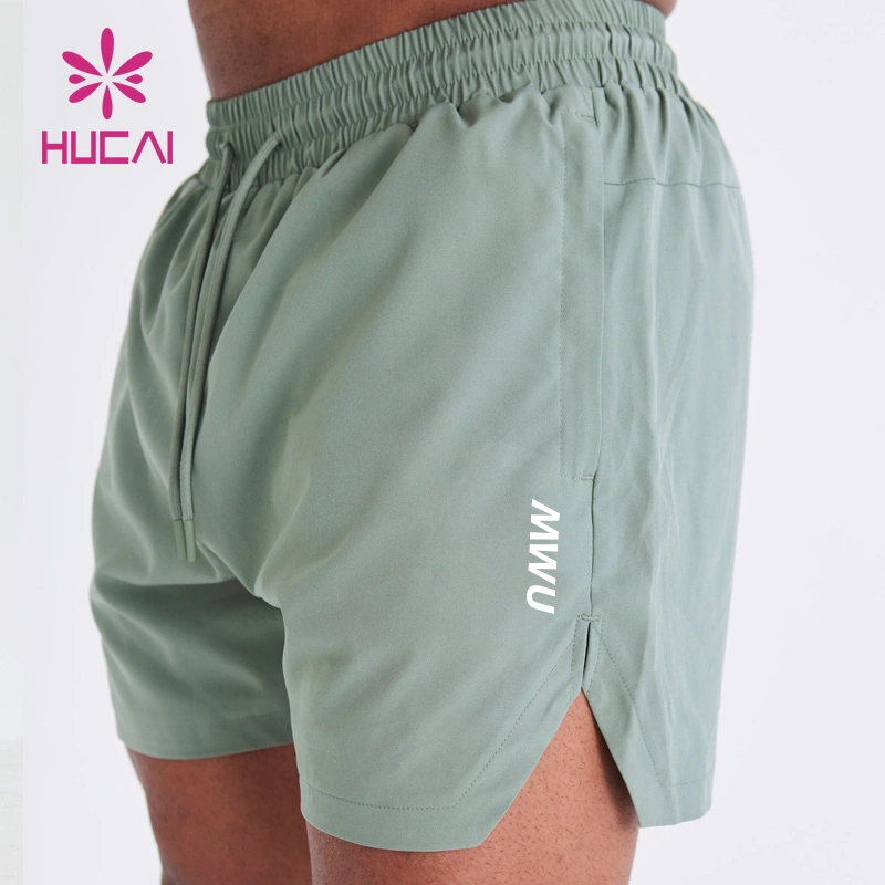ODM Étiquette privée Sports Vente chaude Shorts de gym pour hommes avec poche pour téléphone, séchage rapide, respirant, impression d'écran.