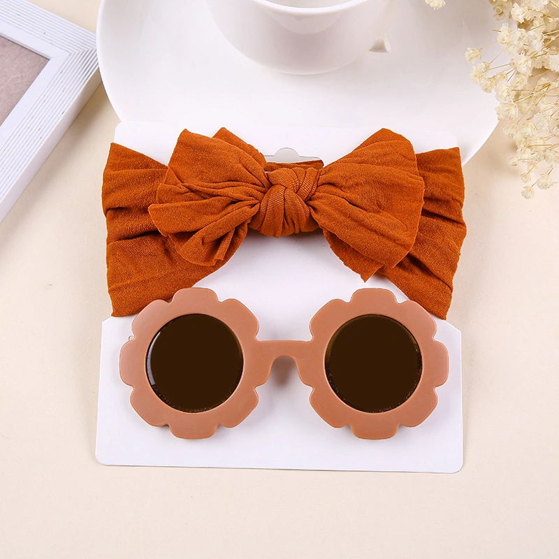 O bebé Toddler Headdress Girl Bow Sweat-Absorbing ajustável e o conjunto de óculos